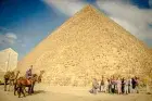 Horse silhouette Giza Pyramids sunset — private Cairo desert horse ride